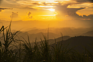 beautiful sunset with clouds in the mountains that are intricate