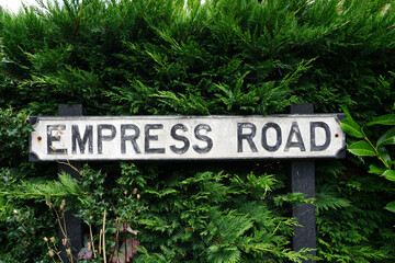 Empress Road signpost in UK village. vintage street name sign 