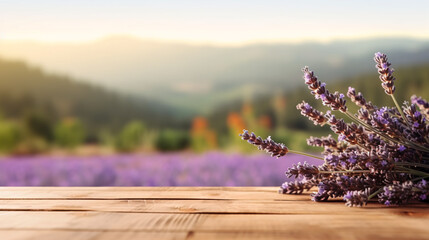Lavender bouquet on the wooden table at organic lavender farm background.