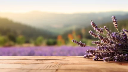 Fotobehang Lavender bouquet on the wooden table at organic lavender farm background. © Sunday Cat Studio