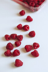 raspberries on a white background