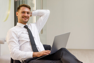 Portrait of a young businessman Using laptop computers together in modern office Data analyst and creative designer