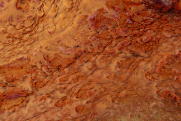 The result of iron waste deposits that are brown and blurred contained in soil with a high iron content 