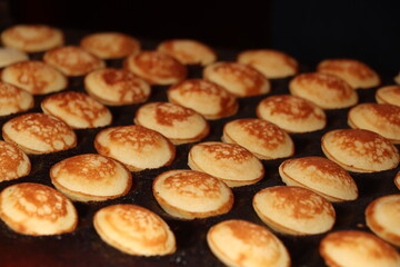 Traditional Dutch Poffertjes, cereal pancakes - 652366112
