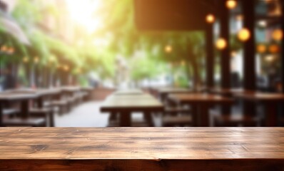 Modern cafe aesthetic. Empty wooden table in soft bokeh light. Vintage counter in eatery. Abstract montage of rustic dark tabletop