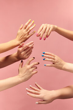 Beautiful Female Hands With Different Manicure, Nail Colors Against Pink Background. Taking Care. Concept Of Hand Care, Cosmetics And Cosmetology, Spa, Natural Beauty. Poster, Ad