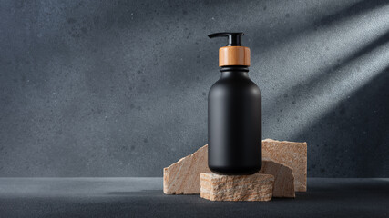 Black bottle with dispenser pump for cosmetics and beauty or bathroom products