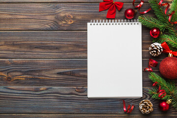 Christmas blank greeting card mock-up scene. Creative layout made of Christmas tree branches and paper card note. Flat lay. Nature New Year concept