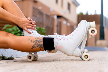 Roller girl resting on the steps