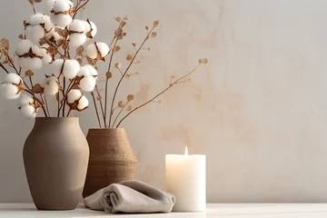 Foto op Plexiglas Stylish table with cotton flowers and aroma candles near light wall © JAYDESIGNZ