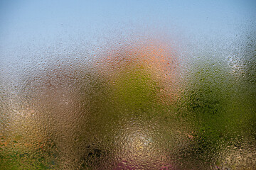 Condensation water drops on a window pane, wet glass.