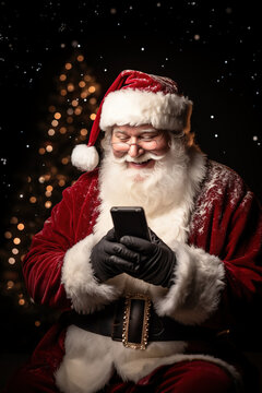 Santa Claus (Papá Noel) looks with amazement at the smartphone he holds in his hand. Christmas, gifts and communication. Vertical photo with copy space.
