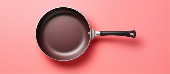 Birds eye view of an isolated frying pan isolated pastel background Copy space - obrazy, fototapety, plakaty