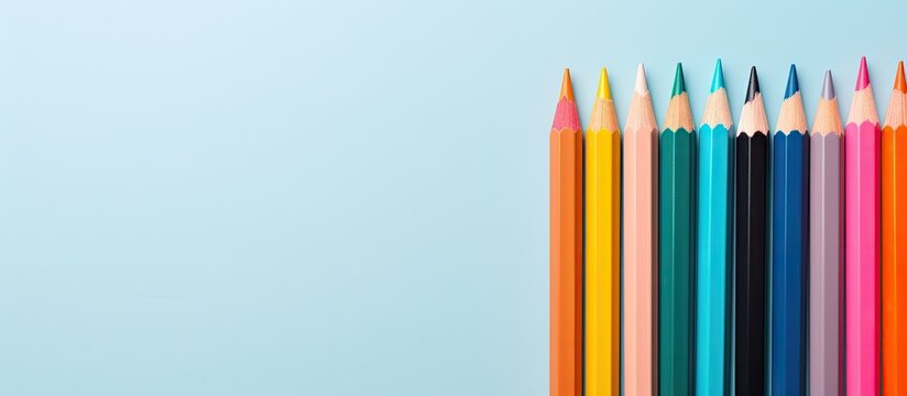 Colored pencils on isolated pastel background Copy space