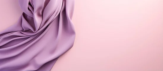 Poster Colorful hijab folded on a isolated pastel background Copy space a trendy accessory for women © vxnaghiyev