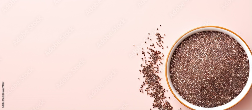 Aufkleber Chia word made from seeds Chia seeds bowl from top view with space Grain isolated pastel background Copy space