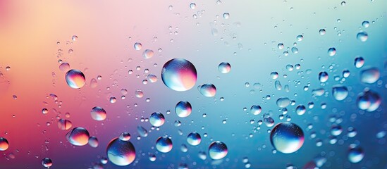 Colored abstractions created by backlit water droplets on glass magnified with bokeh isolated pastel background Copy space