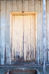 Old wooden door in a rural house, vintage style and selective focus