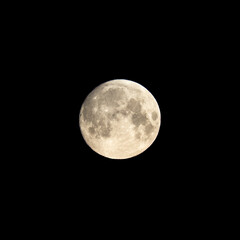 Detailed image of the full moon isolated on black.