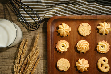 Flat lay composition with chocolate cookies and space for text on wood background
