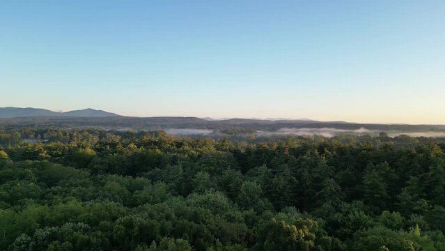 mountain view with mist on a clear morning sunrise (dawn at catskill mountains, hudson valley, upstate new york, forest landscape) turning
