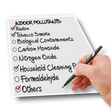 Hand write a check list of indoor air pollutants on white background - concept image