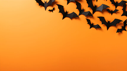 Fototapeta premium Happy halloween holiday concept. Halloween decorations, bats, on orange background. Halloween party greeting card mockup with copy space. Flat lay, top view, overhead.