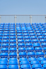 Fototapeta premium Chairs on the podium of the stadium as a background.