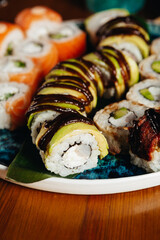 sushi rolls for advertising in an expensive restaurant on blue plates