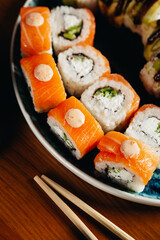 sushi rolls for advertising in an expensive restaurant on blue plates
