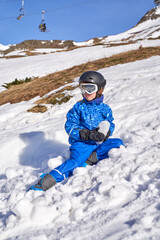 Fototapeta na wymiar Boy with snow lump in mountains