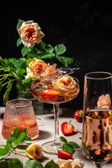 strawberry wine and roses. vertical image. top view. place for text