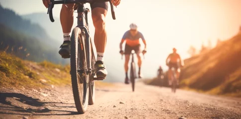 Foto op Plexiglas anti-reflex Team of cyclists rides on mountain road,  at sunset © XC Stock