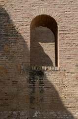 Arch on brick wall of Monastery  in Moguer, Spain - 652443556
