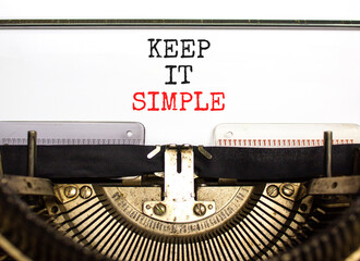 Keep it simple symbol. Concept word Keep it simple typed on beautiful retro old typewriter. Beautiful white paper background. Business motivational keep it simple concept. Copy space.