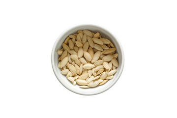 Pumpkin seeds, unpeeled with salt in bowl, isolated on white background with clipping path