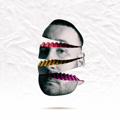 A man's head assembled from blocks. Art collage.