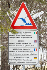 High water danger sign. Possibility of sudden flood waves after manoeuvres on hydraulic plants by...