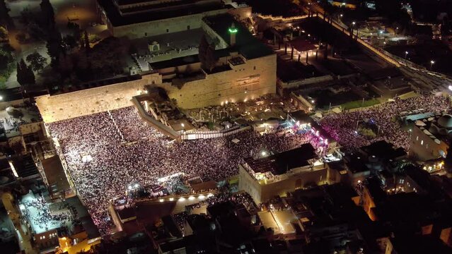 thousnads of jewish prayers at the Kotel, aerial night view

Forgiveness Prayers at The Hebrew month of Elul, before yom kipur, drone view, September 2023
