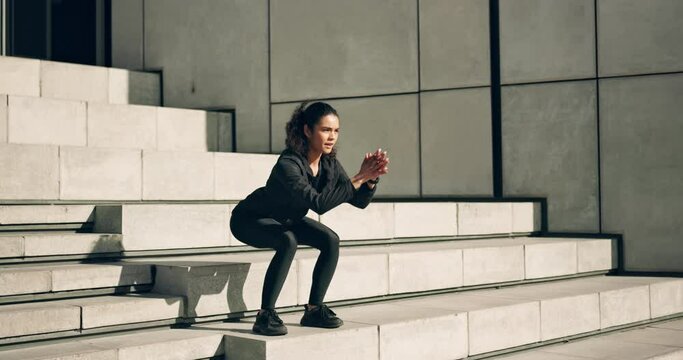 Woman on stairs for fitness, squats or muscle workout on city morning body training with energy. Urban exercise, power and performance, girl on steps for warm up, commitment and healthy outdoor sport