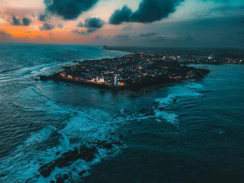 Aerial night view of the renowned Galle Fort, a historic fortress and iconic lighthouse landmark located in Galle, Sri Lanka, Asia. Ideal for travel and historical themes, landscape