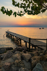 Obraz premium Lakeview at sunset from walkway at Cisano, Bardolino, Lake Garda, Italy