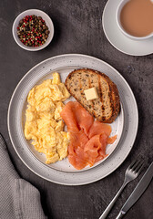 Food photography of scrambled egg; breakfast; brunch; omelette; smoked salmon; toast; wholegrain; bread; seasoning; 