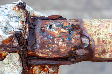 Closeup of an iron railing rusted by the effect of sea air