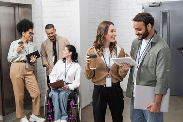 inclusion and diversity, happy multiethnic team standing together near office elevators in hall