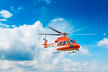 Closeup of flying red helicopter ln blue sky background. Air rescue. Helicopter for rescue. - obrazy, fototapety, plakaty