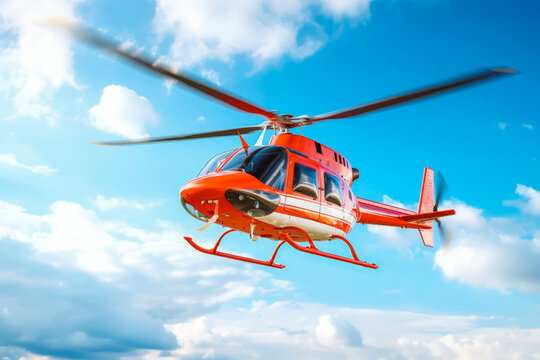 Closeup of flying red helicopter ln blue sky background. Air rescue. Helicopter for rescue.