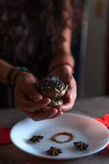 Hands lighting an incense, cleansing ritual, spiritual beliefs, white magic