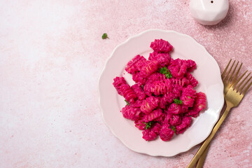 Beetroot Pasta, Barbie Themed Pasta. Pink noodles on pink background.