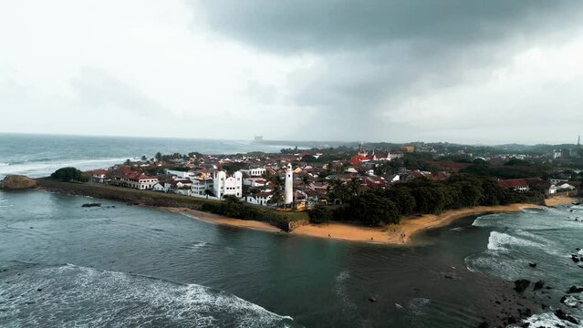 cinematic aerial close-up footage of the famous Galle Fort, an ancient fortress and iconic landmark situated by the Indian Ocean in Galle, Sri Lanka, South Asia. Perfect for travel and historical them